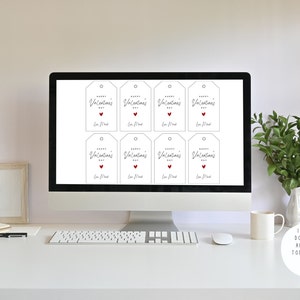 May include: A computer screen displaying eight printable Valentine's Day gift tags. Each tag features the text "Happy Valentine's Day" in cursive script with a small red heart. The tags are ready to be downloaded and printed.