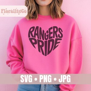 May include: A bright pink sweatshirt featuring a heart-shaped design with the words "Rangers Pride". The bottom of the image shows the words "SVG &bull; PNG &bull; JPG".