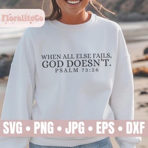 May include: White sweatshirt with the text "WHEN ALL ELSE FAILS, GOD DOESN'T. PSALM 73:26" printed in black.