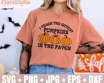 May include: Orange t-shirt with the text "I Teach the Cutest Pumpkins in the Patch" and three orange pumpkin graphics. The shirt is a fall-themed design, perfect for the autumn season.