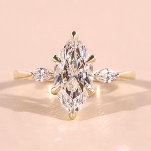 Trilogy Ring
Three Stone Ring
14kt gold ring,CVD Diamond ring,anniversary gifts,art deco ring,diamond ring for her,easter day gift,gifts for girlfriend,lab created diamond,lab grown diamond,marquise diamond,muse engagement ring,vintage style ring,wedding ring 18kt,
IGI certified,diamond ring for her,diamondrensu,engagement ring,kite cut diamond,lab created diamond,lab grown diamond,labor day,marquise cut diamond,ring for women,three stone ring,wedding ring,yellow gold ring