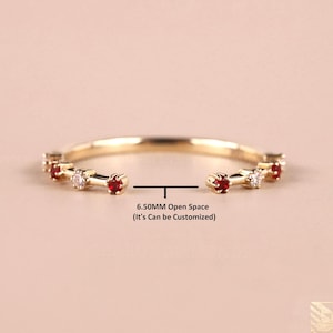 May include: A gold ring with alternating red and white gemstones. The ring has an open space of 6.50MM, with the text "6.50MM Open Space (It's Can be Customized)" below the ring. The ring is set against a soft pink background.