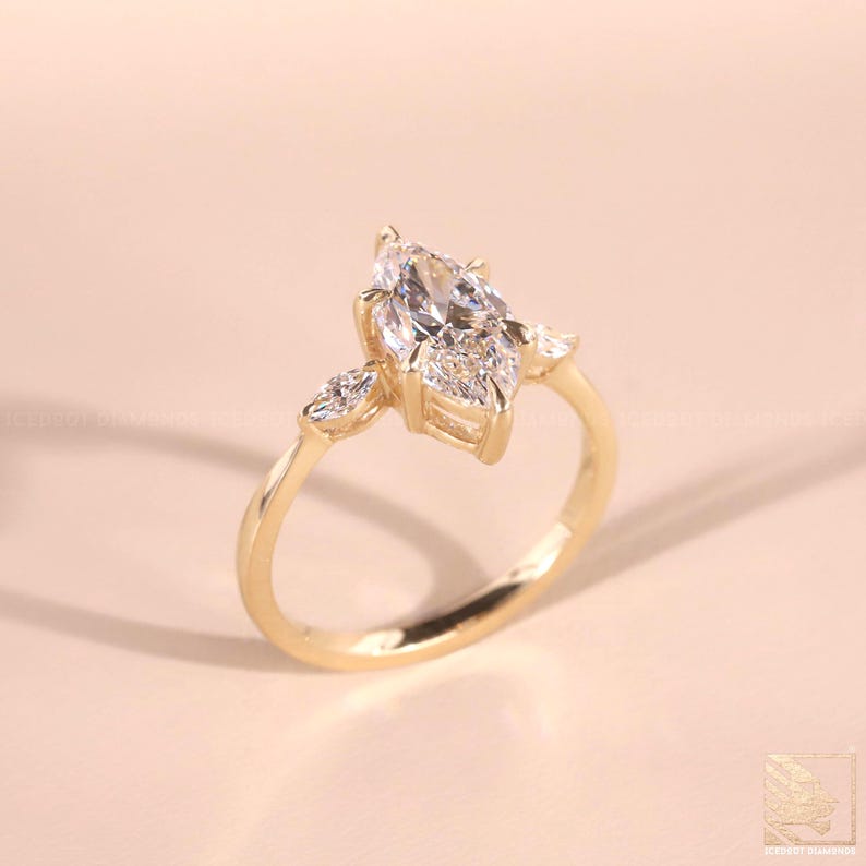 Lab Created Diamond
Marquise Diamond
Vintage Marquise 10k
Wedding Ring 18kt
3.50 CT Marquise Cut Three Stone Engagement Ring, 14K/18K Solid Yellow Gold, Side Stone Pear Cut Diamonds, Promise Wedding Ring Gift For Her
Marquise Cut Moissanite Ring with Pear Side Stones | Three Stone Moissanite Engagement Ring in Yellow Gold | Elegant Marquise Ring for Her
marquise three stone ring
Silver wedding ring
white gold wedding ring
silver engagement ring women,
trilogy ring women, mens engagement ring,