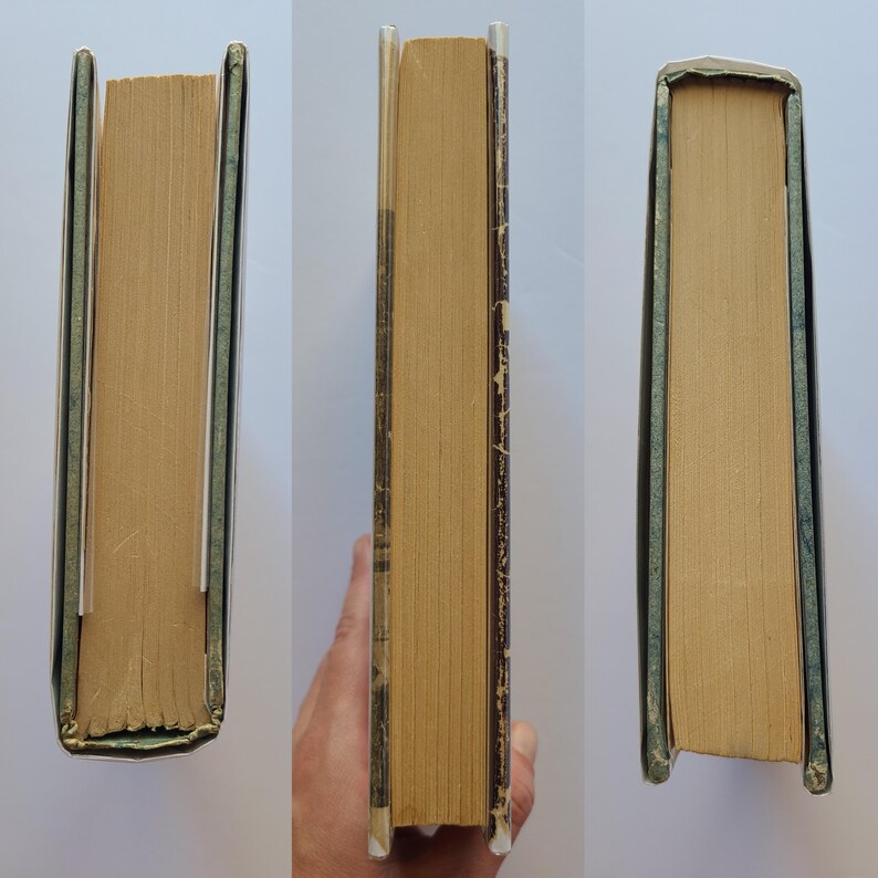 May include: Three views of a vintage book, showing the aged, yellowed pages and the spine. The book's edges are worn, with a green and silver cover. The book is held by a hand in one of the views.