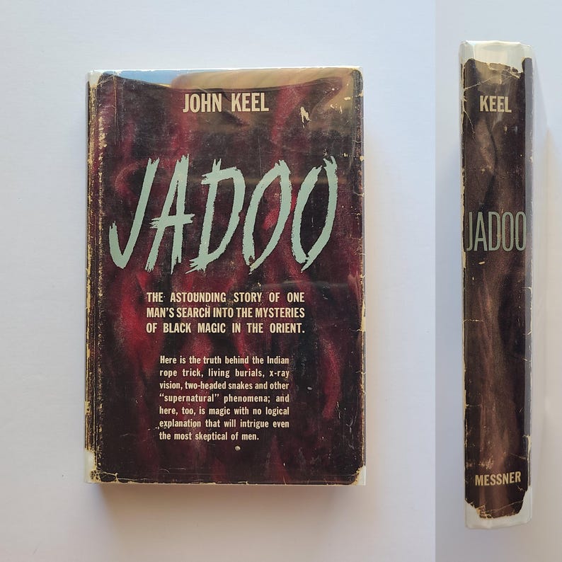 May include: A vintage copy of "Jadoo" by John Keel. The book's cover has the title in large, light green letters on a dark red and black background. The spine also shows the title and author. The book explores black magic.