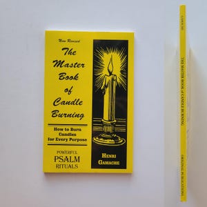 May include: A yellow book titled "The Master Book of Candle Burning: How to Burn Candles for Every Purpose" with a black and white illustration of a candle on the cover. The book also includes the text "Powerful Psalm Rituals" and "Henri Gamache".