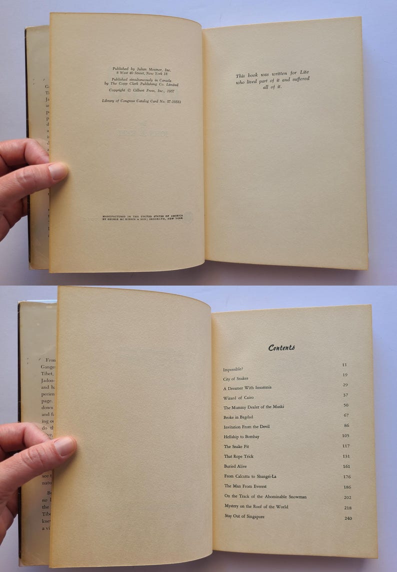 May include: An open vintage book with aged, yellowed pages. One page displays publication details, the other a quote. The contents page lists chapters such as "City of Snakes" and "The Snake Pit". The book is held open.