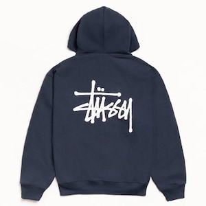 May include: Navy blue hoodie with a white logo on the back. The hoodie features a hood and long sleeves. The logo is a stylized wordmark in a bold, sans-serif font.