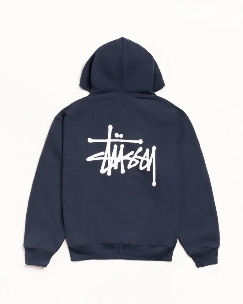 May include: Navy blue hoodie with a white logo on the back. The hoodie features a hood and long sleeves. The logo is a stylized wordmark in a bold, sans-serif font.