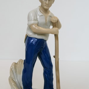 Porcelain figurine of a man with a scythe Carl Scheidig Gräfenthal Germany