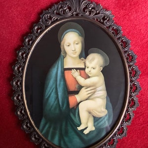 Beautiful copper frame print of Mary with child behind glass