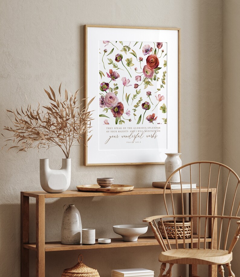 May include: A framed print with a watercolor floral design and a bible verse: "They speak of the glorious splendor of your majesty, and I will meditate on your wonderful works." Psalm 145:5
