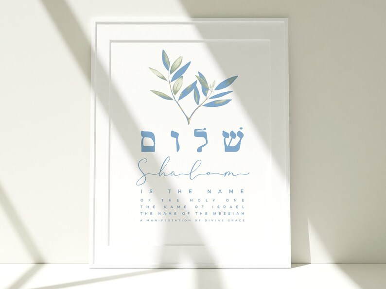 May include: A blue and white printable art print with the Hebrew word "Shalom" written in blue, meaning peace. The print also includes a blue olive branch with green leaves.