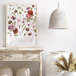 May include: A white framed print with a watercolor floral design and a bible verse that reads "They speak of the glorious splendor of your majesty, and I will meditate on your wonderful works." Psalm 145:5