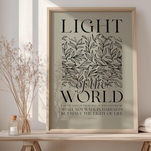 May include: A light green poster with black text and a black floral design. The text reads "LIGHT of the WORLD I am the light of the world he who follows me shall not walk in darkness but have the light of life."