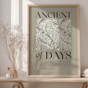 May include: A beige poster with a black floral pattern and the text "ANCIENT of DAYS" in black. The text below the floral pattern reads "THE ANCIENT OF DAYS WAS SEATED HIS GARMENT WAS WHITE AS SNOW AND THE HAIR OF HIS HEAD WAS LIKE PURE WOOL HIS THRONE WAS A FLAME OF FIRE AND HIS WHEELS WERE A BURNING FIRE DANIEL 7:9"