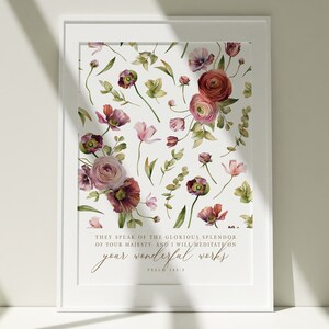 May include: A watercolor print with a floral design in shades of pink, red, and green. The print features the text "THEY SPEAK OF THE GLORIOUS SPLENDOR OF YOUR MAJESTY AND I WILL MEDITATE ON YOUR WONDERFUL WORKS" and the words "PSALM 145:5".