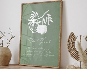 Può includere: Una stampa incorniciata con uno sfondo verde e un'illustrazione bianca di un ramo di melograno con il testo "The Fruit of the Spirit is love, joy, peace, patience, kindness, generosity, faithfulness, gentleness, self-control."
