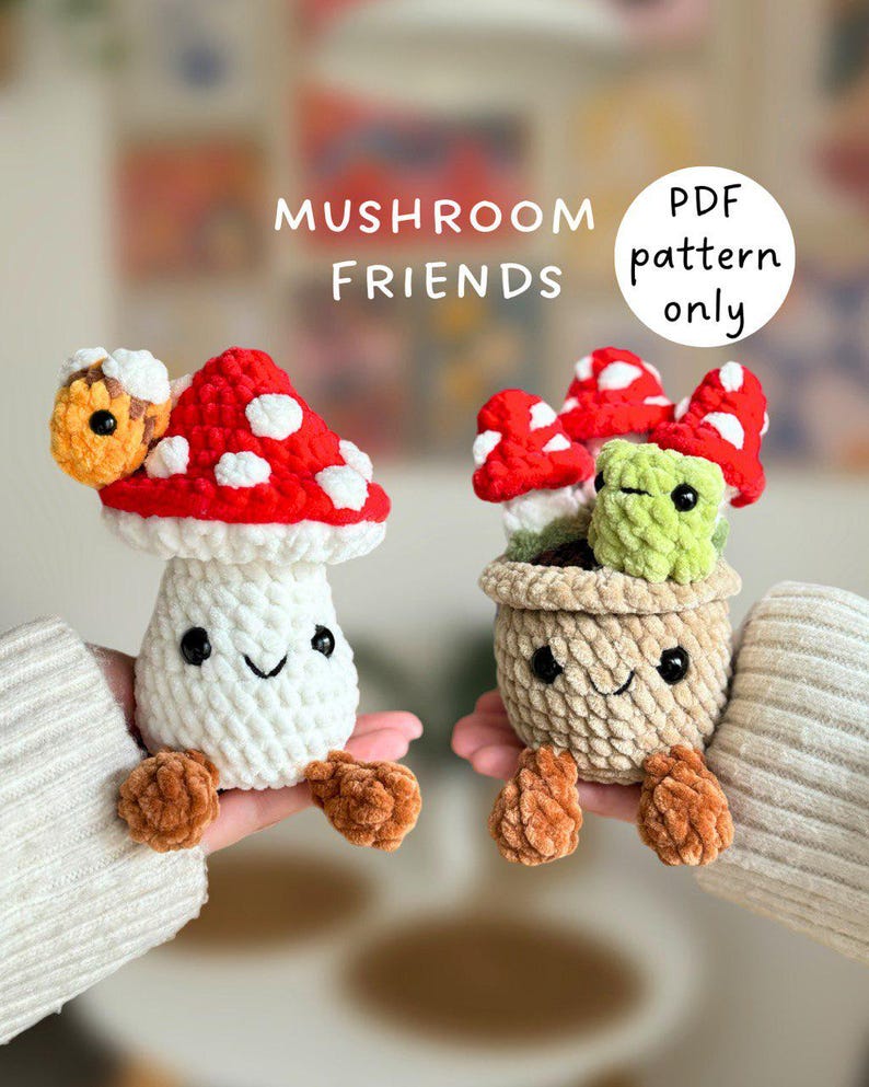 May include: Two crocheted mushroom figures. One has a red and white spotted cap, the other is in a pot with red and white mushrooms and a green cube. The text "Mushroom Friends" and "PDF pattern only" are visible.