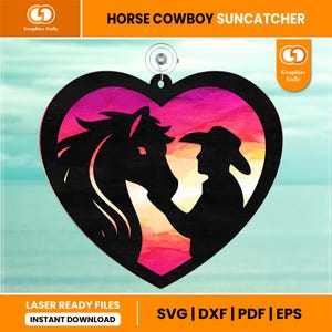 May include: A heart-shaped suncatcher with a black silhouette of a horse and cowboy. The background has a watercolour effect with pink, orange, and yellow hues. The text "HORSE COWBOY SUNCATCHER" is at the top.