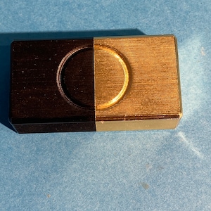Vintage mascot pill container slide mechanism to tone, gold and black. Excellent condition. Very rare.