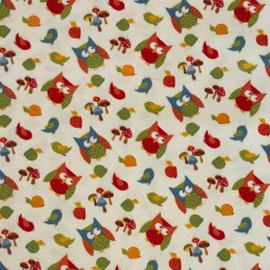 May include: A cream-colored fabric with a repeating pattern of colorful owls, birds, snails, mushrooms, and leaf shapes. The owls are red, orange, and blue. The birds are green and blue. The snails are orange. The mushrooms are red and brown.
