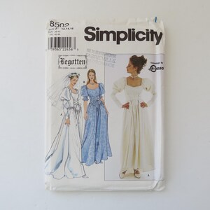 May include: A vintage Simplicity sewing pattern packet, featuring illustrations of three different wedding dress designs. The packet is white with the Simplicity logo and the number 8502. The packet also includes the text "Begotten" and "Trimmings by Conso".