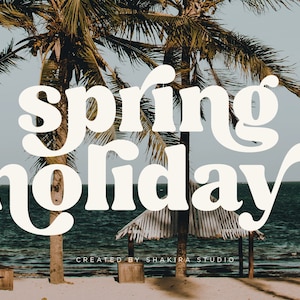 May include: White text on a beach background with palm trees. The text reads "spring holiday" with a stylized font. The text is created by Shakira Studio.