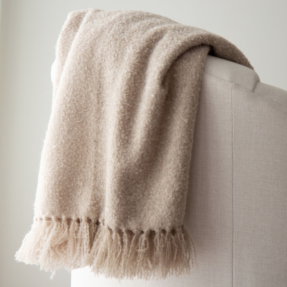 Oatmeal colored outlet throw blanket
