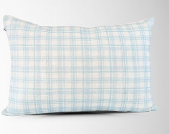 May include: A light blue throw pillow with a white and light blue plaid pattern.
