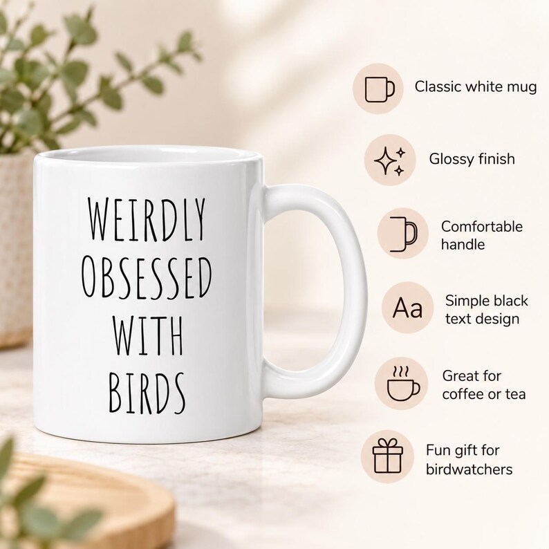 May include: A white ceramic mug with a glossy finish and a comfortable handle. The front features the black text WEIRDLY OBSESSED WITH BIRDS in a simple font. The mug is presented alongside icons and text describing it as a classic white mug.