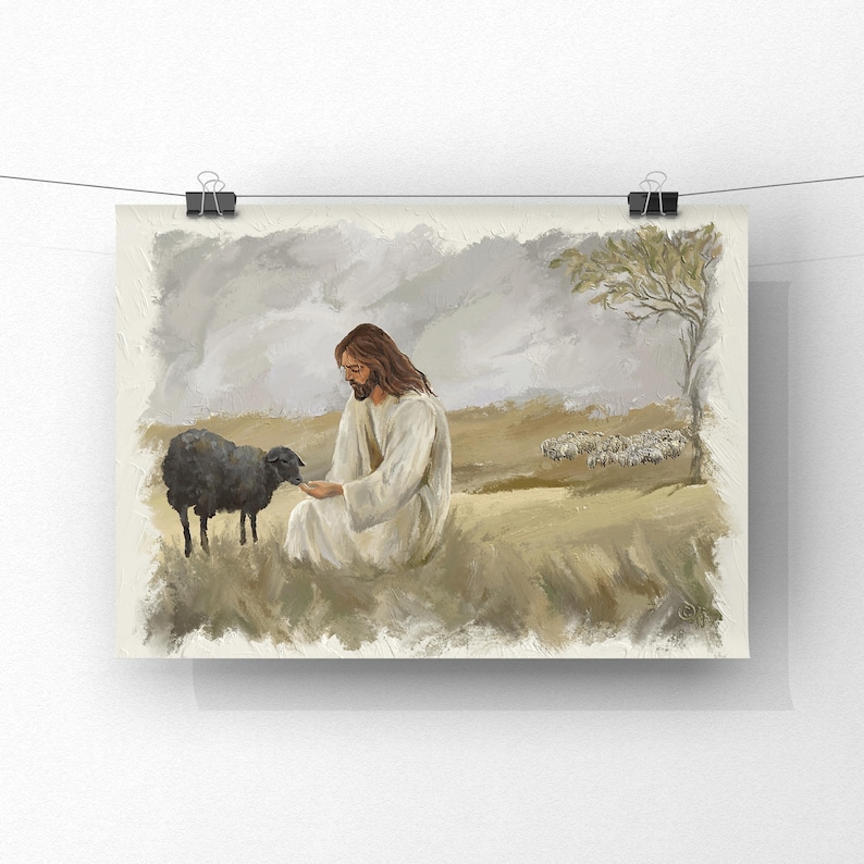May include: An art print showing a figure in a white robe with long brown hair, interacting with a black sheep. The pastoral scene includes a flock of sheep, a tree, and a cloudy sky, all rendered in soft, muted tones.