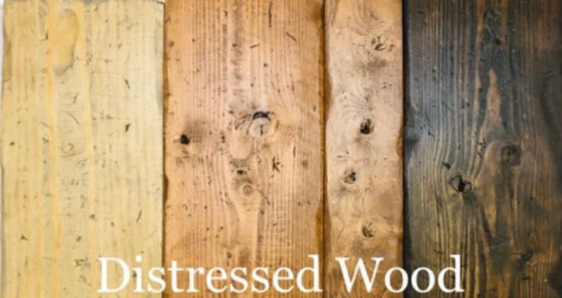 May include: Close-up of four wood planks showing different shades of distressed wood. The planks are arranged vertically and the text "Distressed Wood" is printed below the planks.