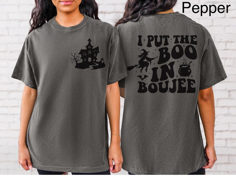 May include: A gray t-shirt with a black graphic of a haunted house on the front and the text "I put the boo in boujee" on the back.