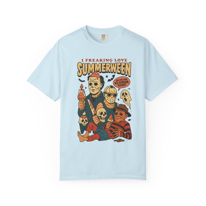 May include: Pale blue t-shirt with a graphic of horror movie characters holding ice cream cones. The text "I FREAKING LOVE SUMMERWEEN" is above the characters, with a speech bubble that says "CAN I GET SOME ICE CREAM PLEASE?"