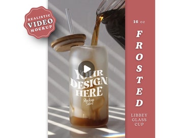 May include: A frosted glass cup with a straw and a lid, being filled with a dark liquid. The cup has the text "Your Design Here" printed on it. The cup is 16 oz and is made by Libbey.