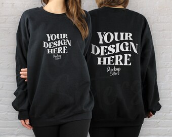 May include: Black sweatshirt mockup with the text "YOUR DESIGN HERE" on the front and back. The text is in a white retro font with the words "Mockup Sisters" underneath.