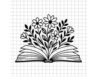 May include: Black and white line art illustration of an open book with flowers and leaves growing from the pages. The image is on a grid background, suggesting a design or craft project.