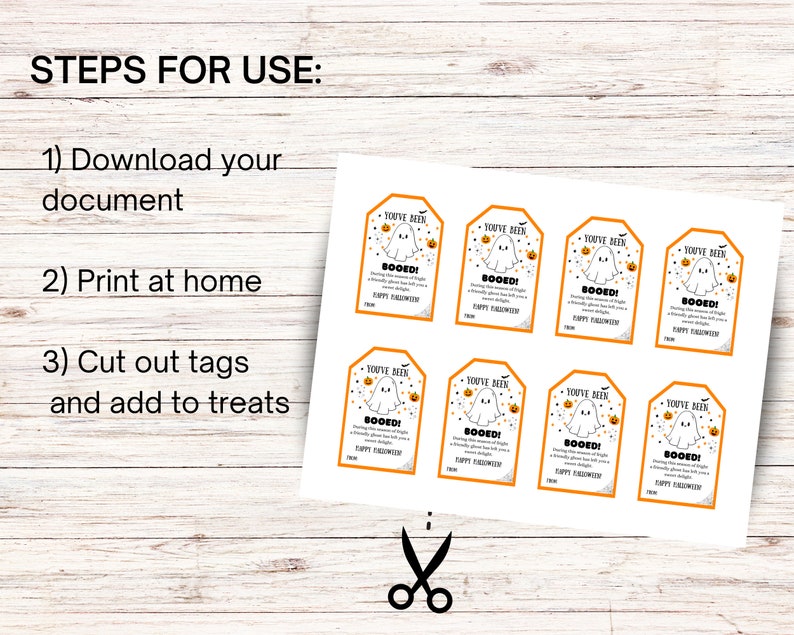 May include: A sheet of printable Halloween gift tags with an orange border, featuring a ghost and pumpkin design. The tags read "You've Been Booed!" and include instructions: Download, Print, Cut, and Add to Treats.