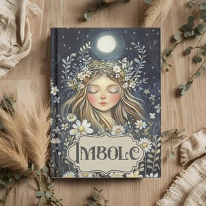 May include: A hardcover journal with a serene illustration of a woman with closed eyes, a floral crown, and long flowing hair, set against a night sky with a full moon. The word "IMBOLC" is displayed in a decorative frame.