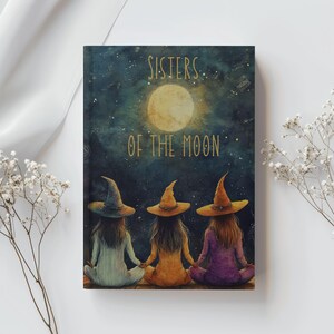May include: A book cover featuring three figures in witch hats, seated and holding hands, with the text "Sisters of the Moon" above them. The background is a night sky with a full moon.