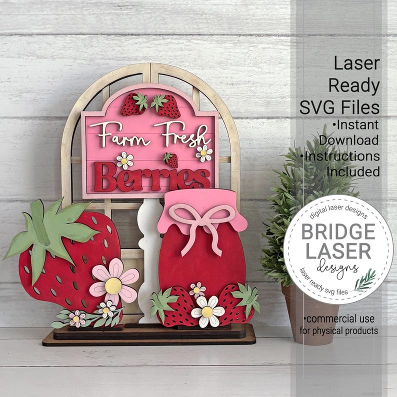 May include: A wooden strawberry-themed sign with the text "Farm Fresh Berries." The sign features a strawberry, a jar of jam, and a window frame design. The sign is made of layered wood and includes the text "Laser Ready SVG Files."