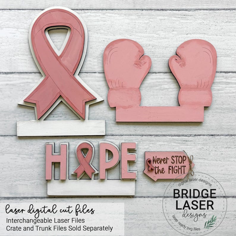 May include: A set of laser-cut wooden shapes including a pink awareness ribbon, two pink boxing gloves, the word HOPE with a ribbon replacing the letter O, and a small sign with the text Never STOP the FIGHT and a small ribbon icon.