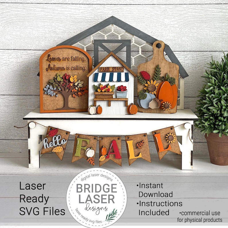 May include: A wooden fall-themed decorative set featuring a banner that spells "FALL", a tree with colorful leaves, a farm stand, and a cutting board with pumpkins and sunflowers. The set includes the text "Leaves are falling, Autumn is calling."
