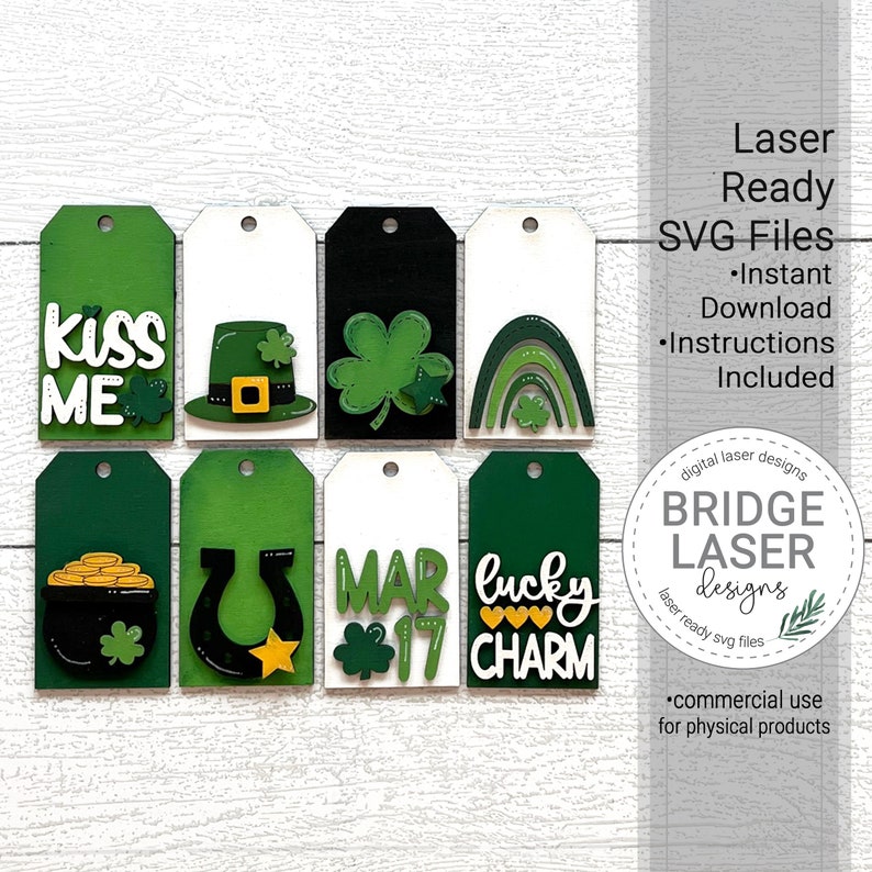 May include: Eight laser-cut wood tags with a St. Patrick's Day theme. The tags feature various designs including a pot of gold, a horseshoe, a leprechaun hat, a shamrock, a rainbow, and the words "Kiss Me", "Mar 17", and "Lucky Charm".