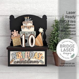 May include: A wooden birthday countdown decoration featuring a tiered cake with candles, the number 10, a gift box, and a party hat. The words "BIRTHDAY countdown" are displayed at the bottom. The design is laser-ready and includes SVG files.