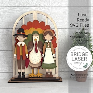 May include: A wooden Thanksgiving-themed decoration featuring a turkey and two figures in pilgrim attire, set against a window-like frame. The turkey has a red wattle and a colorful tail. The text "Laser Ready SVG Files" is visible.