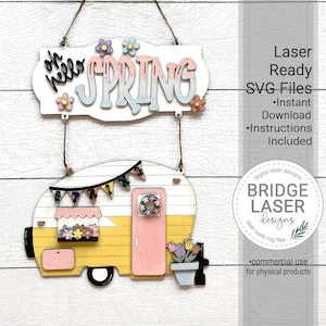 May include: A digital download of a laser cut SVG file for a spring-themed camper with the text "Oh hello spring" on a banner. The camper is yellow with pink accents and has a flower box and a wreath on the door. The file is for commercial use for physical products.