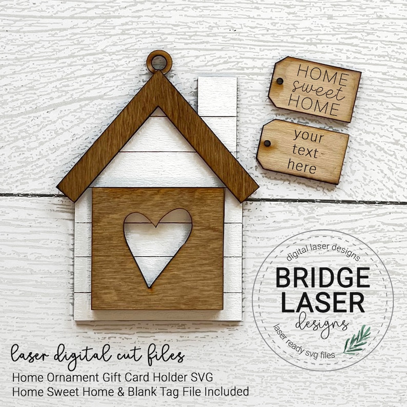 May include: Laser cut file design for a home ornament or gift card holder. The design features a small house with a heart cutout and two blank tags that say "Home Sweet Home" and "Your Text Here".