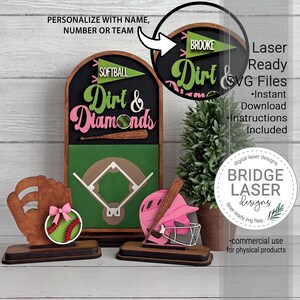 May include: A wooden softball-themed tiered tray decor set featuring an arched sign with the text Dirt & Diamonds, a baseball glove with a softball, and a pink batting helmet. The sign includes a green pennant with the text SOFTBALL or BROOKE.